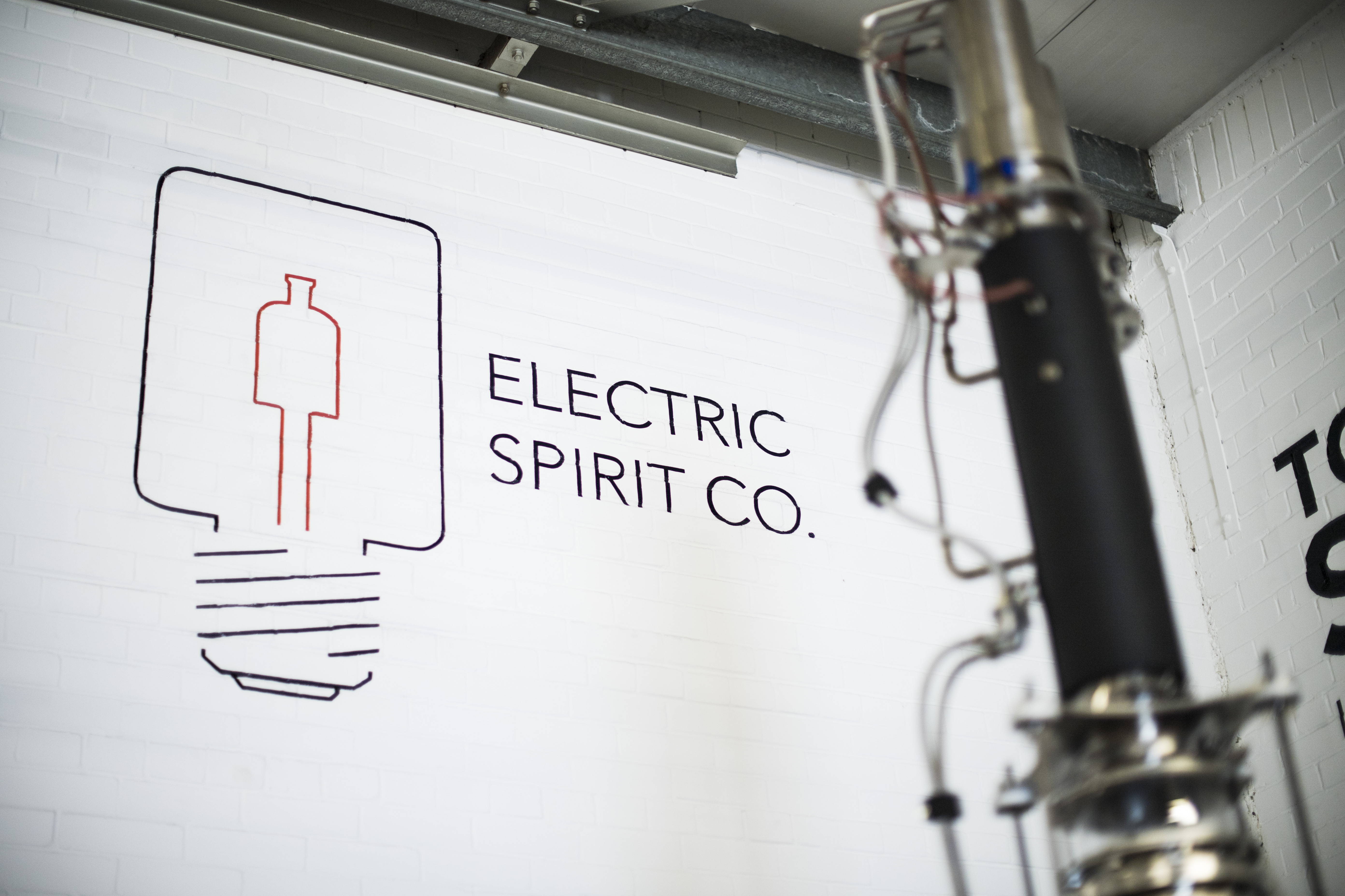 Electric Spirit Co logo on a wall.